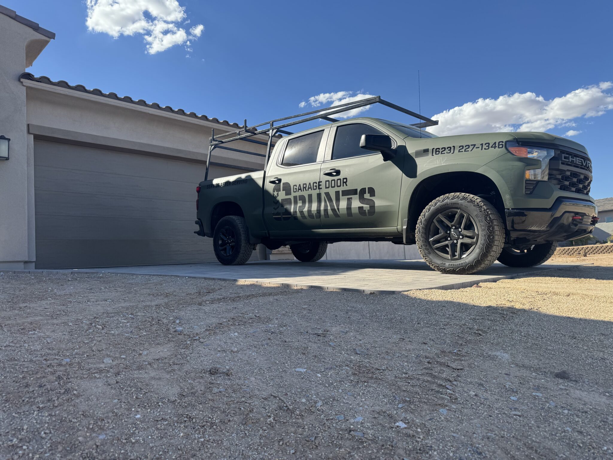 Garage Door Grunts service truck on a garage door repair call in Phoenix, AZ