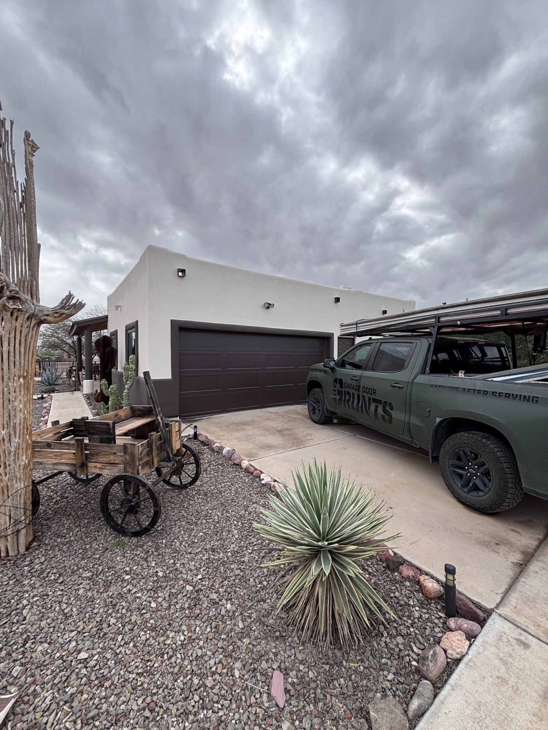 Garage Door Grunts Service Truck outside a Phoenix Residents Home