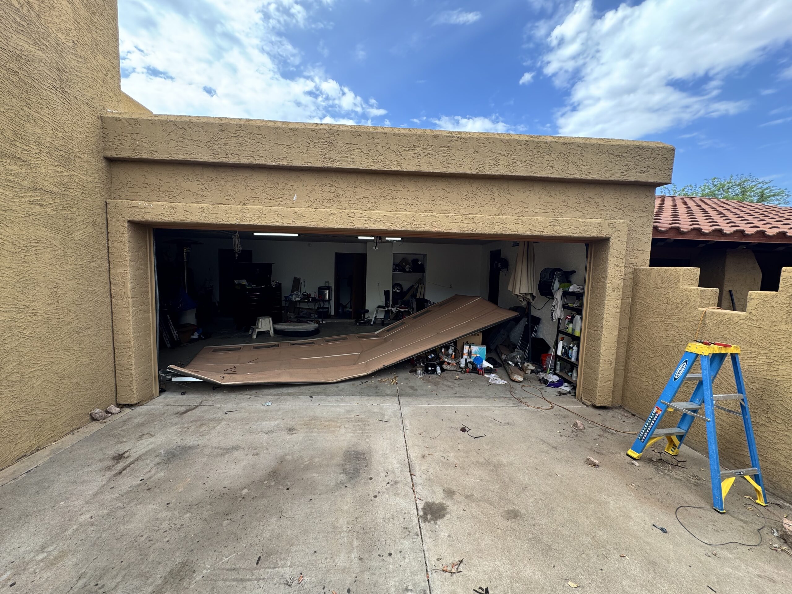Cable Snapped on Garage Door Causing Catastrophic failure. Garage Door needed to be replaced.