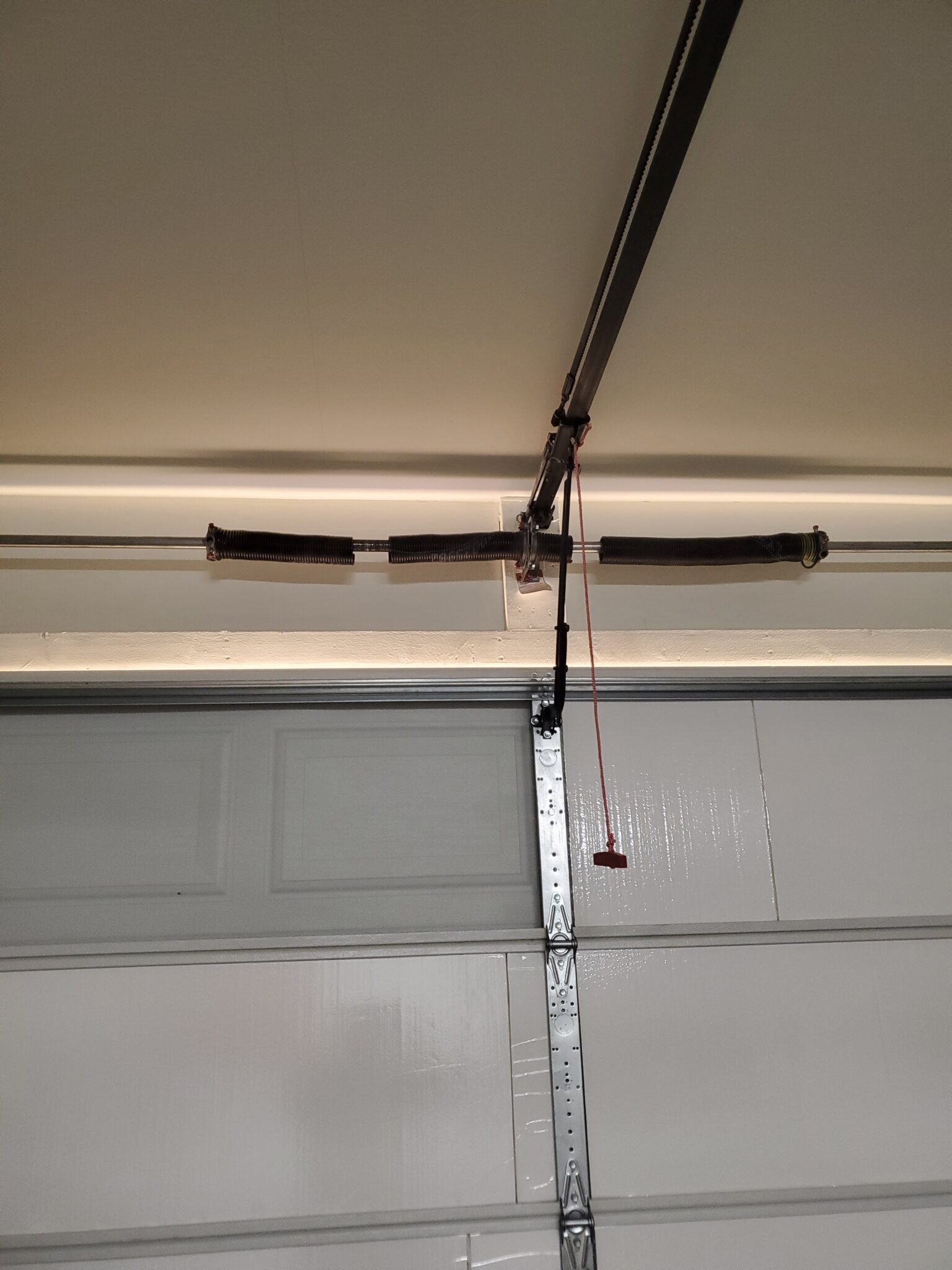 Two broken torsion springs on a garage door in Phoenix, AZ
