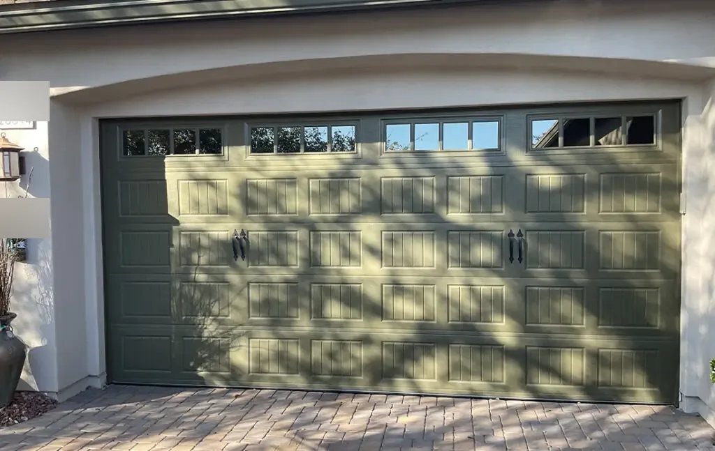 Tan sectional garage door on a desert home