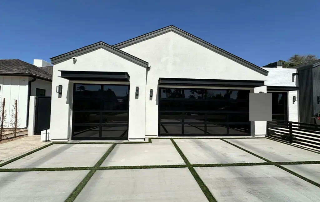 White farmhouse-style home with two garage doors