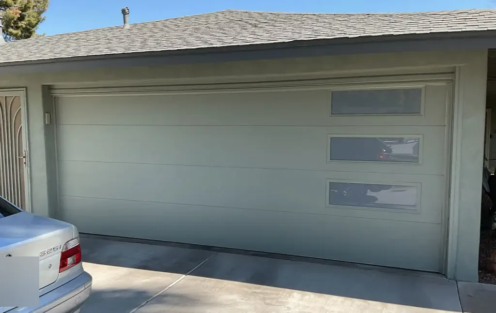 Almond long-panel garage door with modern rectangular windows