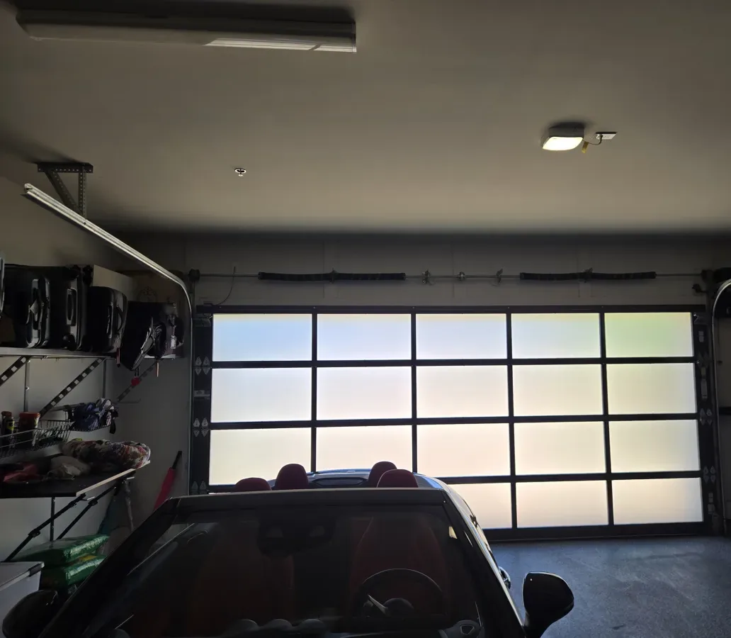 Frosted full-view aluminum and glass garage door seen from inside a Paradise Valley garage