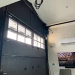 Inside view of a tall carriage-style garage door with window lites in Paradise Valley