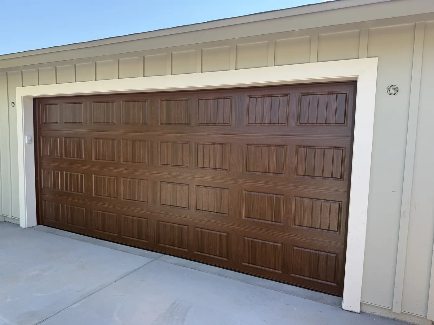 New wood-look garage door installed by Garage Door Grunts in Scottsdale, Arizona